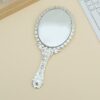 Gilded Vintage Handheld Mirror: Ornate Portable Makeup Mirror (Gold/Silver)