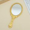 Gilded Vintage Handheld Mirror: Ornate Portable Makeup Mirror (Gold/Silver)